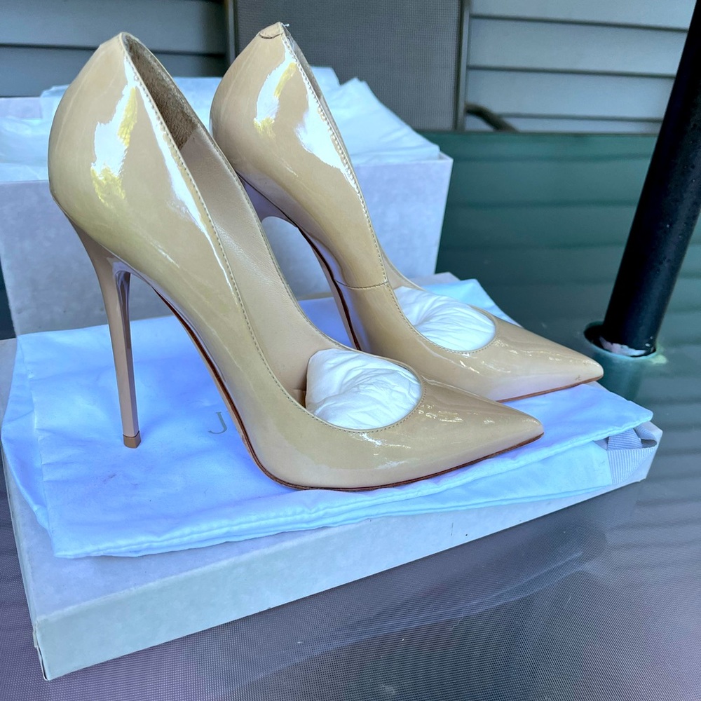 Your classic Jimmy Choo patent leather pump. 4” heel size 36.5 (6.5). Worn once.